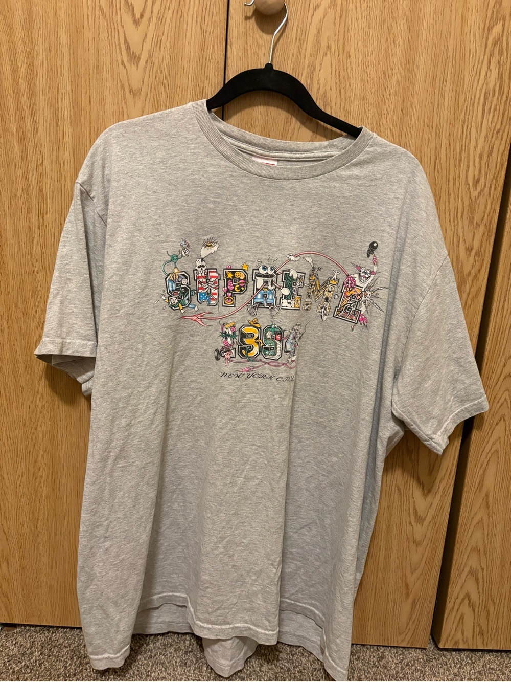Supreme Light Gray Graphic Tee with Multicolor Chest Print